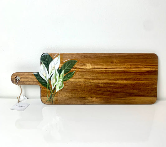 Hand-painted Peace Lilly cutting board by Macey Cliatt